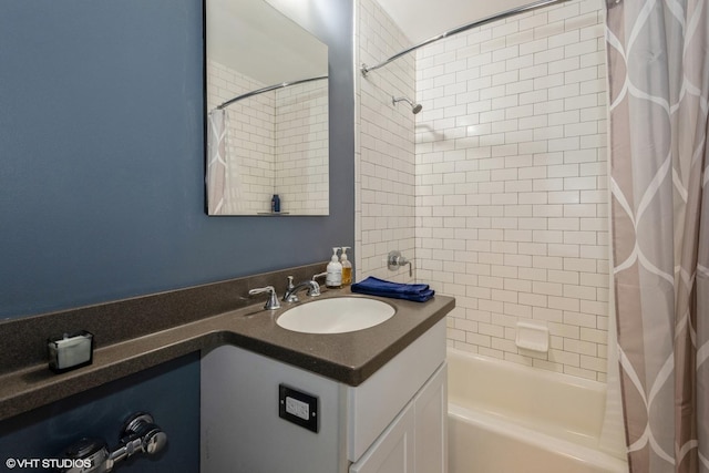 bathroom featuring shower / bath combo and vanity