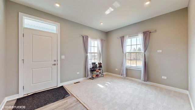 entrance foyer featuring recessed lighting, visible vents, and baseboards