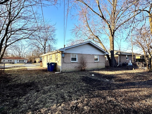 view of home's exterior with brick siding