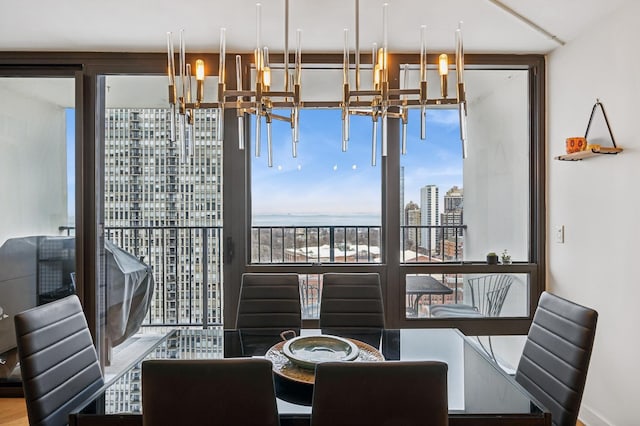 dining space with a view of city and a notable chandelier