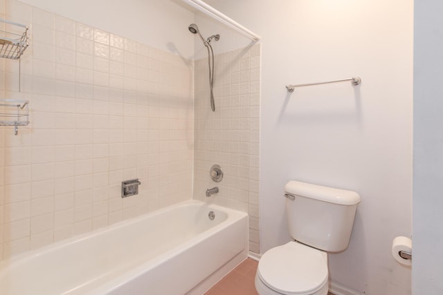 bathroom featuring tile patterned flooring, baseboards, shower / bathing tub combination, and toilet