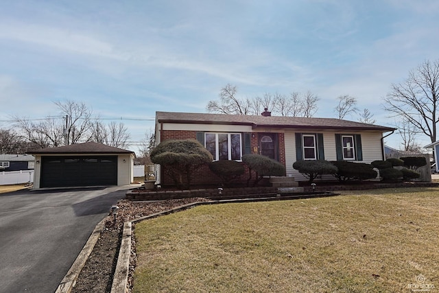 ranch-style house featuring brick siding, a detached garage, a chimney, an outdoor structure, and a front lawn