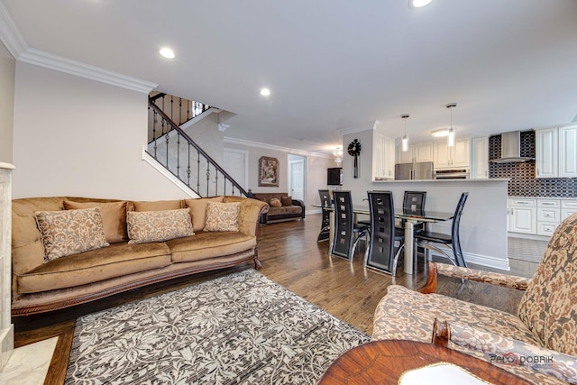 living area with ornamental molding, recessed lighting, dark wood-style flooring, and stairway