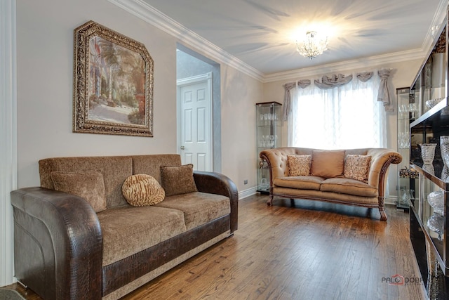 sitting room with crown molding, baseboards, and hardwood / wood-style flooring