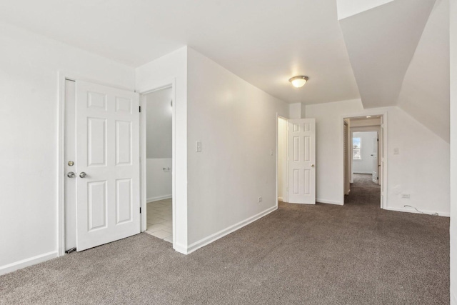 bonus room featuring lofted ceiling, baseboards, and carpet flooring