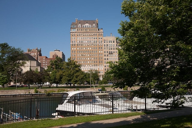 view of property's community with a water view and a city view