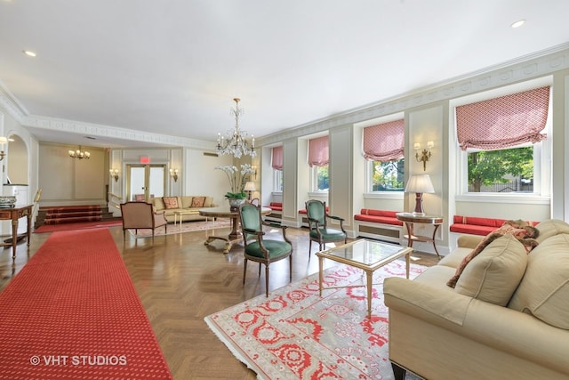 living area featuring a chandelier, recessed lighting, and crown molding