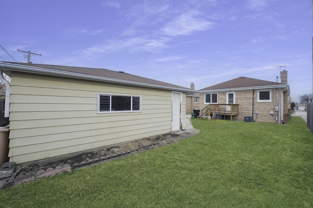 rear view of house with a lawn