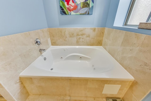 full bathroom with a jetted tub