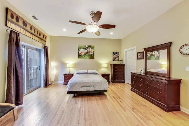 bedroom featuring access to outside, light wood-style flooring, baseboards, and visible vents