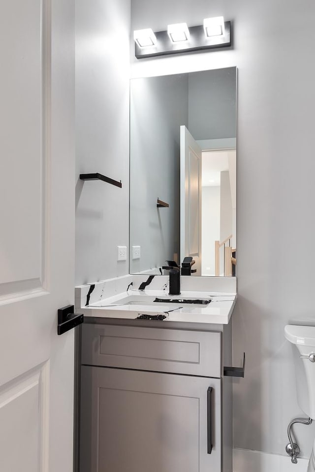 half bathroom with vanity