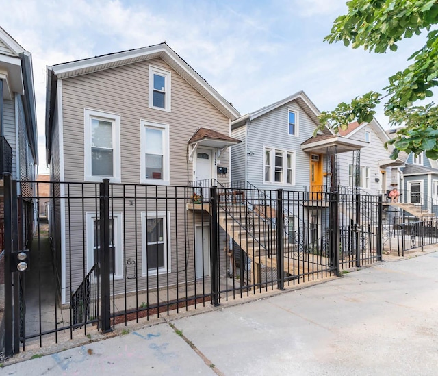 1932 W 22nd Pl, Chicago, IL 60608 - view of front facade featuring a fenced front yard and a residential view