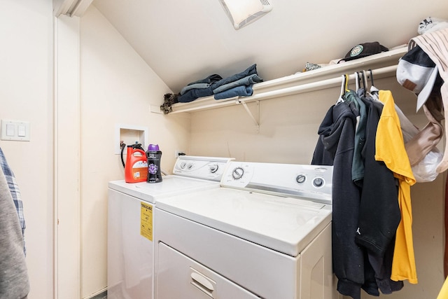 washroom featuring laundry area and washing machine and dryer