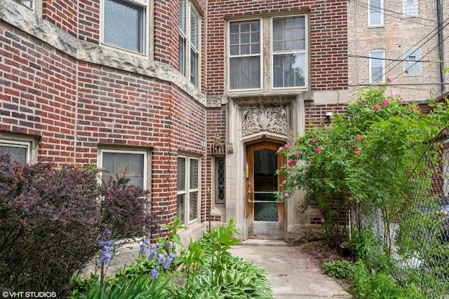 property entrance with brick siding