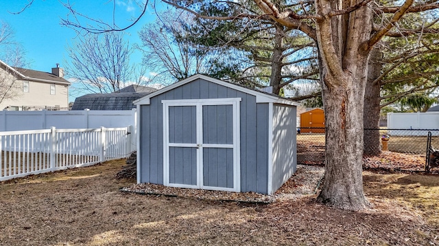 view of shed featuring a fenced backyard