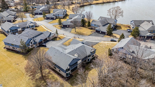 birds eye view of property with a residential view and a water view