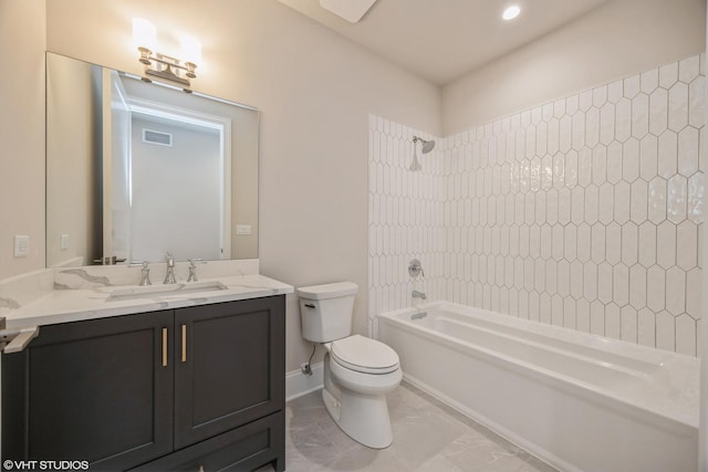 bathroom featuring visible vents, toilet, washtub / shower combination, vanity, and baseboards