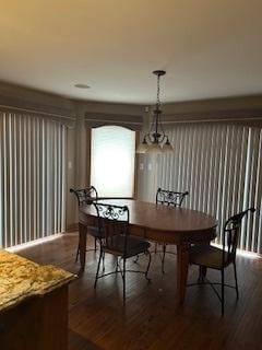 dining area featuring dark wood finished floors