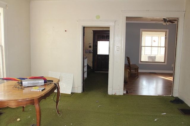 dining area featuring visible vents, ceiling fan, baseboards, and wood finished floors