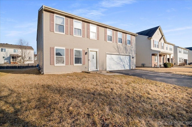 view of front of house with a garage, a residential view, driveway, and a front lawn