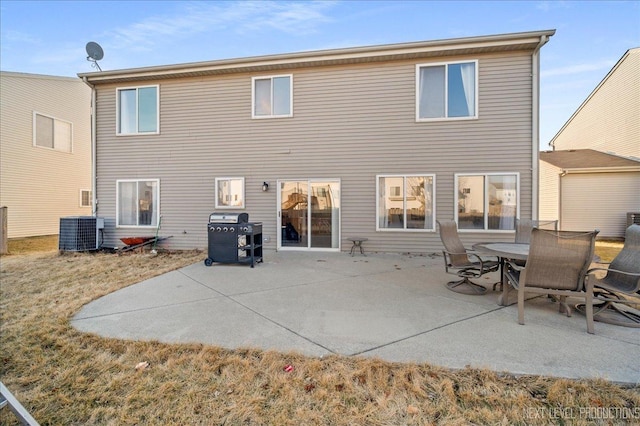 back of house featuring central AC and a patio