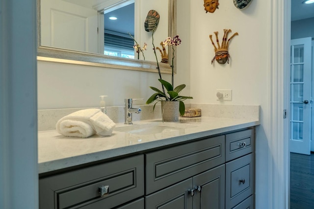 bathroom with recessed lighting and vanity