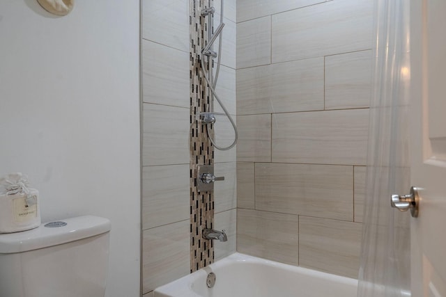 full bathroom featuring toilet and bathing tub / shower combination