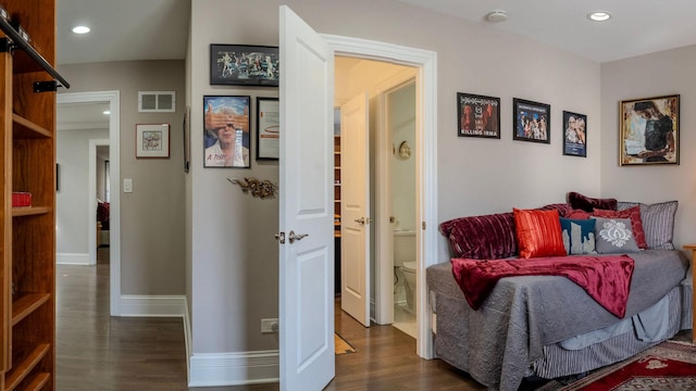 interior space featuring dark wood finished floors, recessed lighting, visible vents, and baseboards