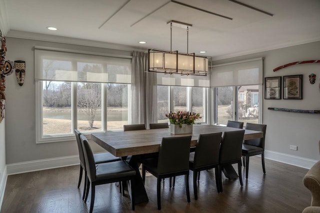 dining area with baseboards, dark wood-style flooring, and ornamental molding