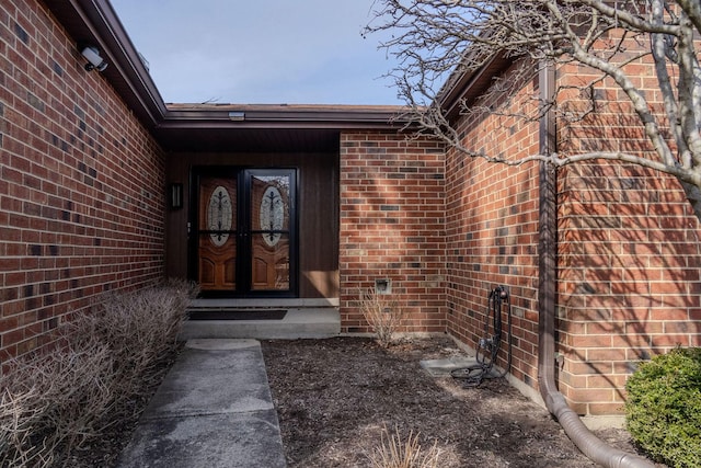 entrance to property with brick siding