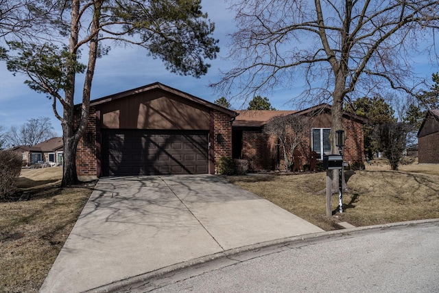 mid-century inspired home with concrete driveway, a garage, brick siding, and a front yard