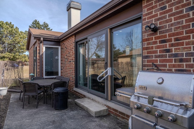 view of patio with grilling area and outdoor dining space