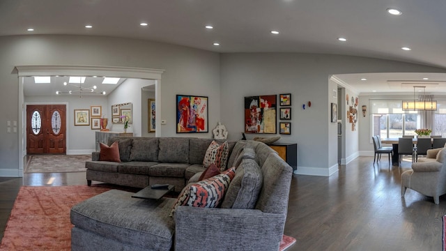 living room featuring recessed lighting, baseboards, lofted ceiling, and wood finished floors