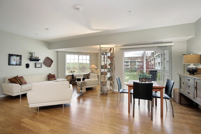 dining area featuring baseboards and wood finished floors