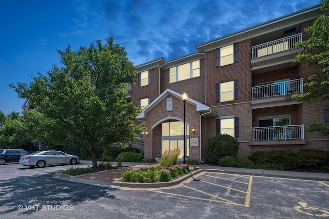 view of property with uncovered parking