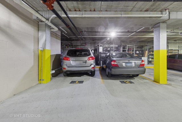 parking garage featuring concrete block wall