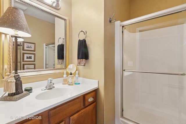 bathroom featuring a stall shower and vanity