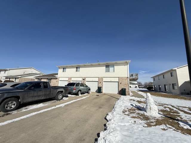 view of front of property featuring driveway and an attached garage