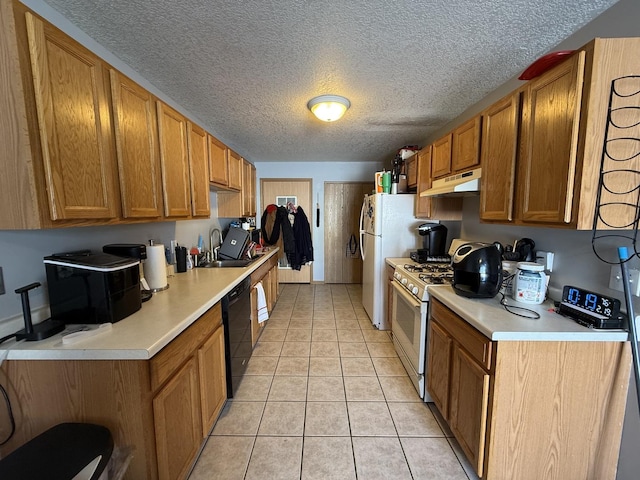 kitchen featuring black dishwasher, light countertops, under cabinet range hood, a sink, and light tile patterned flooring