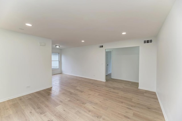 unfurnished room featuring visible vents, baseboards, light wood-style flooring, and recessed lighting