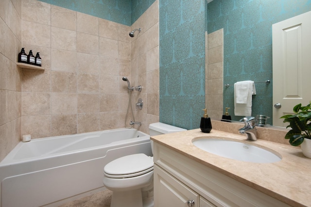 bathroom with toilet, shower / bath combination, tile walls, and vanity