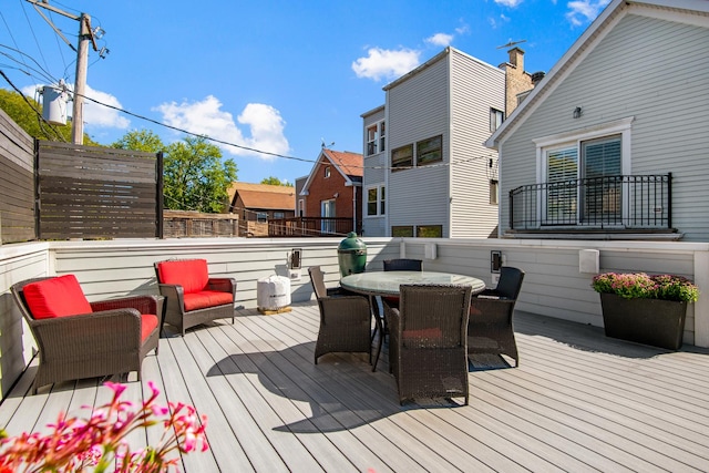 deck with outdoor dining area