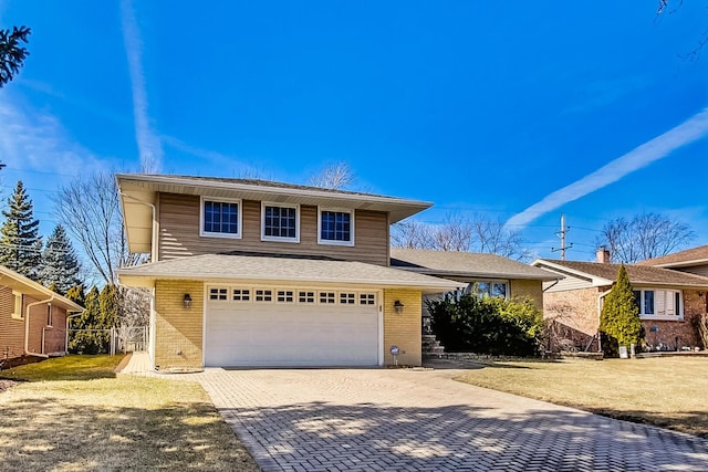 view of front of home featuring an attached garage, fence, decorative driveway, a front lawn, and brick siding