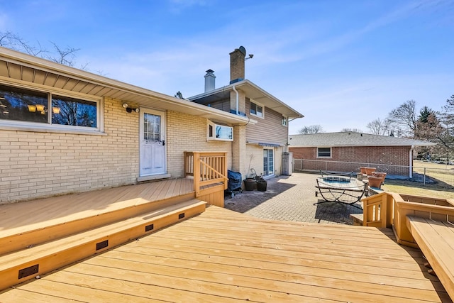 wooden terrace with fence and a patio