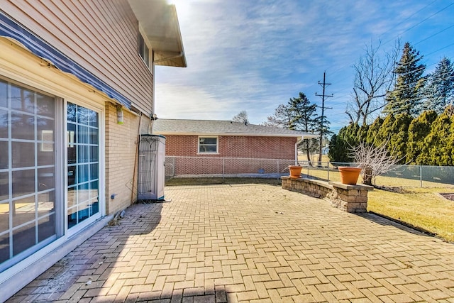 view of patio / terrace featuring fence