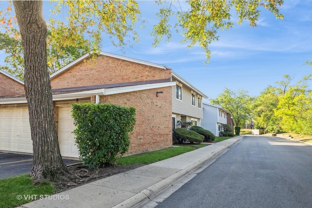 1012 N Bayside Dr, Palatine, IL 60074 - view of side of home with community garages and brick siding