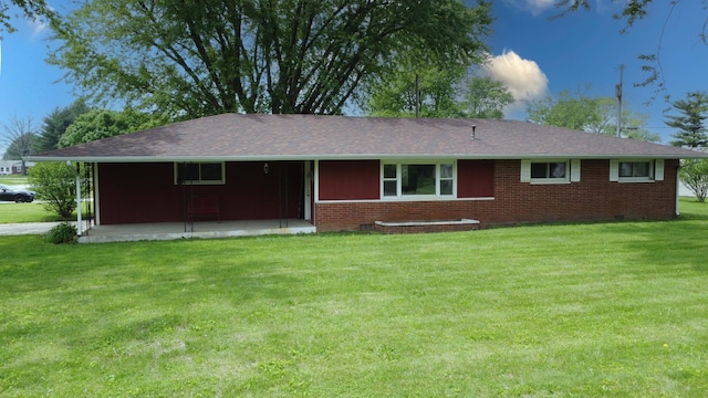 1978 Fleming St, Watseka, IL 60970 - ranch-style house featuring a front lawn, brick siding, and a patio area