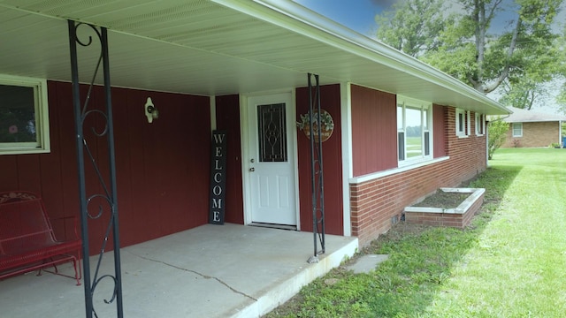1978 Fleming St, Watseka, IL 60970 - doorway to property featuring a lawn and brick siding