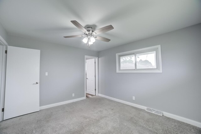 1978 Fleming St, Watseka, IL 60970 - unfurnished bedroom featuring carpet floors, baseboards, and a ceiling fan