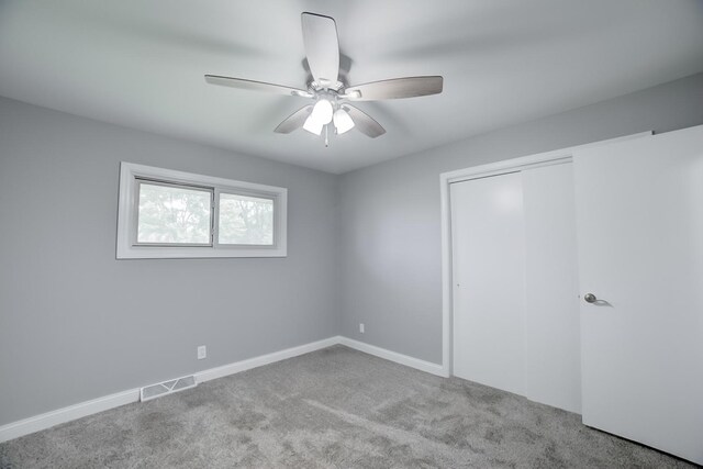 1978 Fleming St, Watseka, IL 60970 - unfurnished bedroom with carpet, a closet, ceiling fan, and baseboards